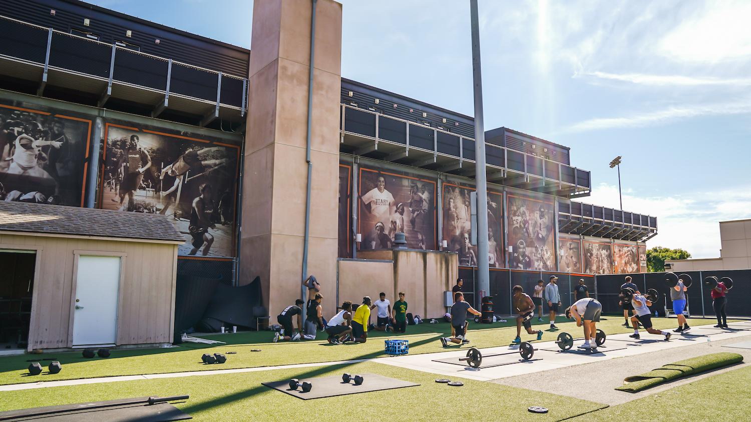 Athletic students outside.