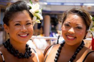 Two women of color in traditional clothing